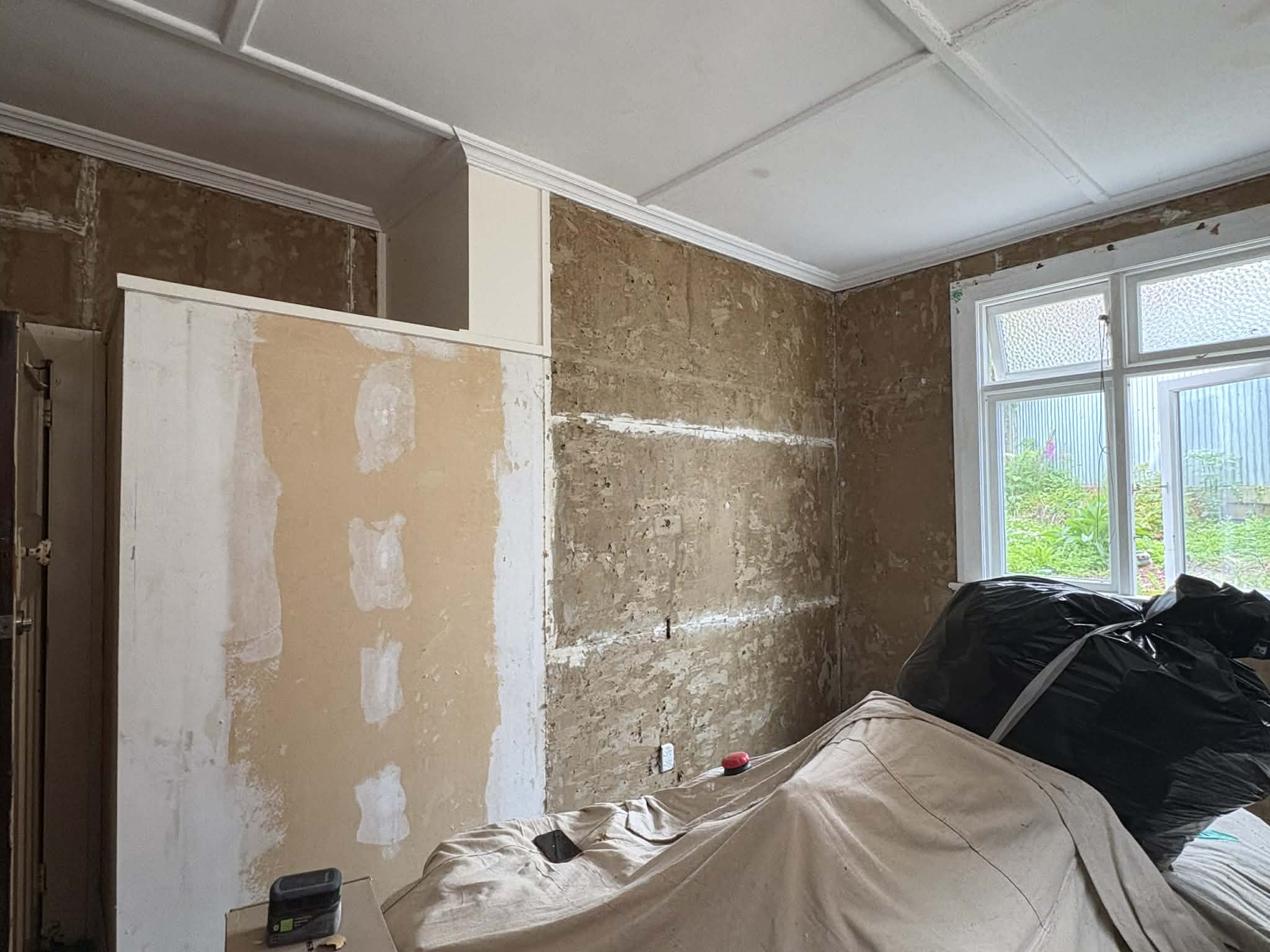 Bedroom painting preparation in Dunedin — filling and sanding before repaint