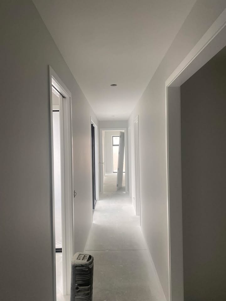 New build hallway painting in Dunedin — tidy edges and smooth walls